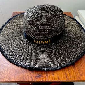 Black and gold Miami Beach elegant tropical hat.